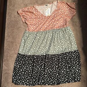 Knee length boutique dress, multi colored and size large. NWT